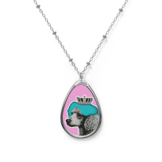 The 'Pop Art Crowned Poodle Oval Pendant Necklace' features a vibrant and colorful design of a regal poodle in pop art style, set within an elegant oval pendant. This unique and stylish piece combines artistic flair with a love for dogs, making it an ideal accessory for fashion-forward pet enthusiasts.