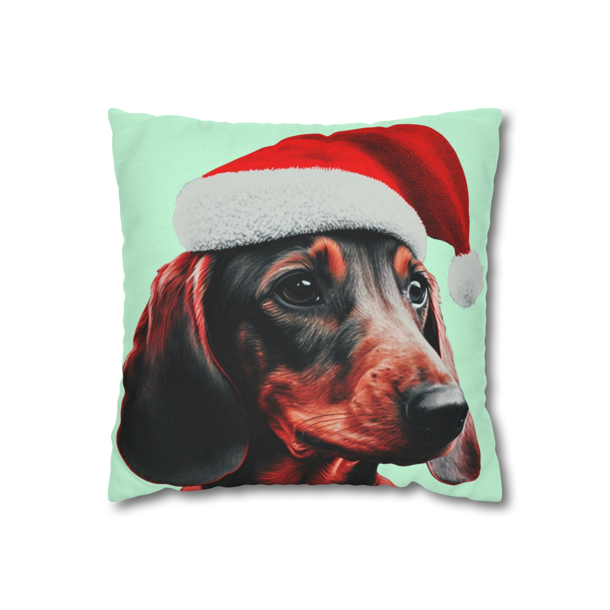 A cushion cover depicting a cute Dachshund wearing a Christmas hat, set against a calming mint green pastel background for a festive and adorable look.