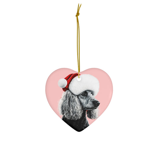 A heart or circle-shaped Christmas ornament featuring an elegant black and white poodle on a soft pastel pink background, perfect for a sophisticated holiday touch.