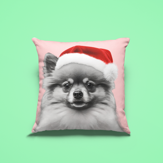 A cushion cover featuring a festive Pomeranian in holiday attire on a charming pink background, perfect for adding a cozy and cheerful touch to holiday decor