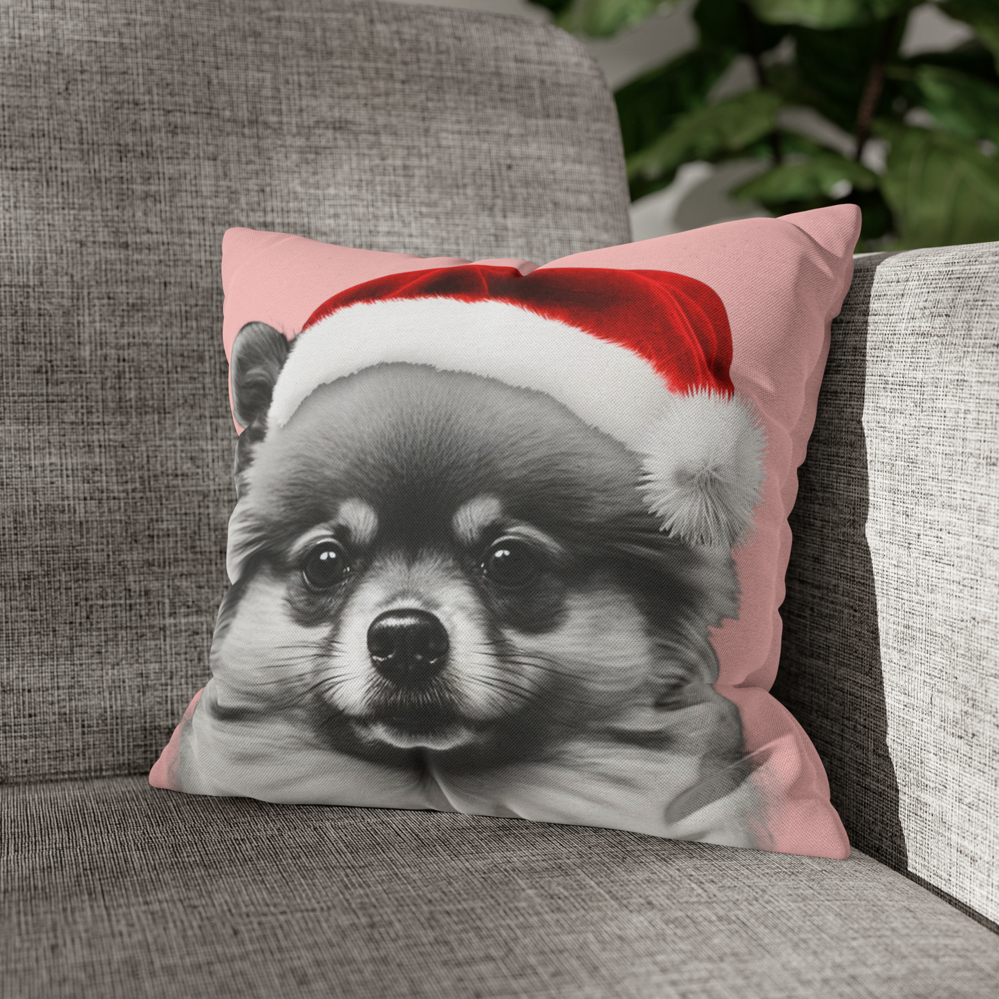 A cushion cover featuring a festive Pomeranian in holiday attire on a charming pink background, perfect for adding a cozy and cheerful touch to holiday decor