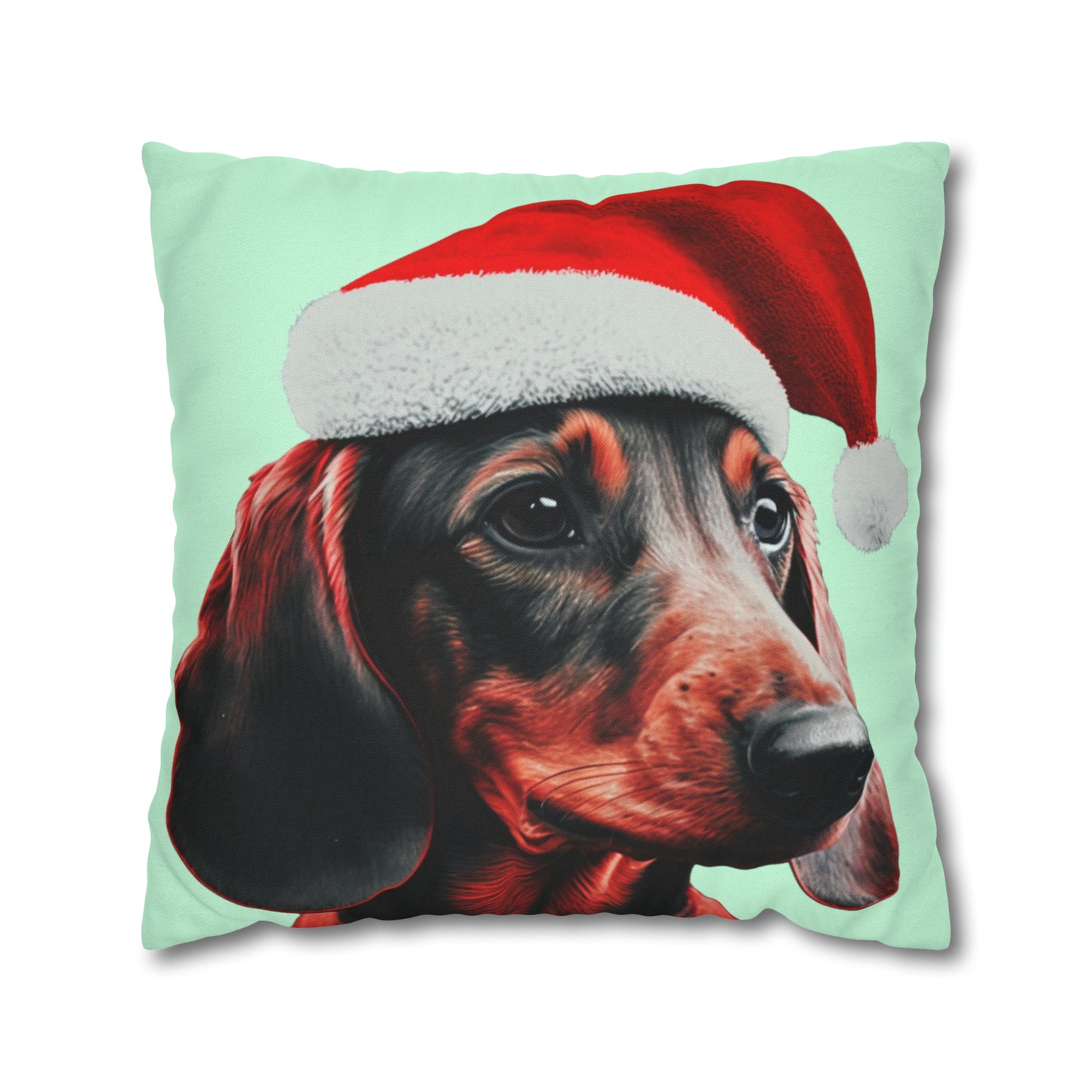 A cushion cover depicting a cute Dachshund wearing a Christmas hat, set against a calming mint green pastel background for a festive and adorable look.