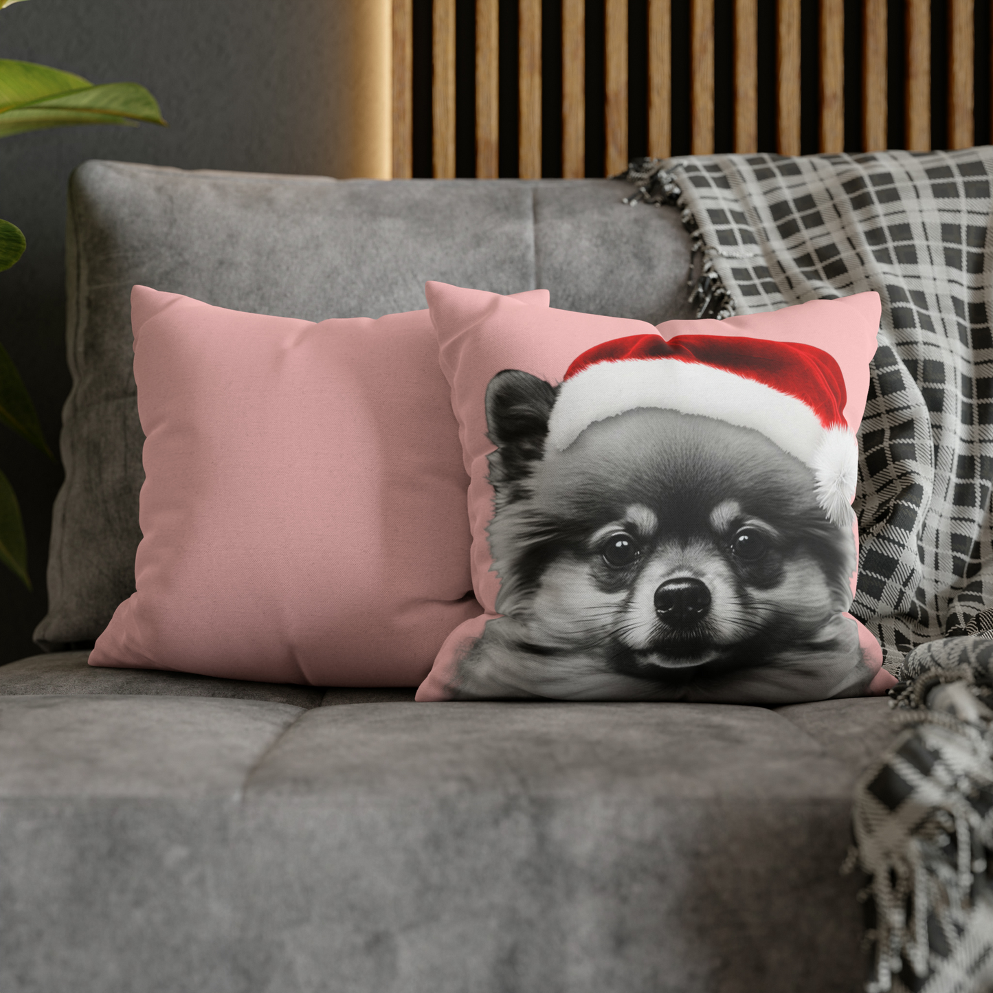 A cushion cover featuring a festive Pomeranian in holiday attire on a charming pink background, perfect for adding a cozy and cheerful touch to holiday decor