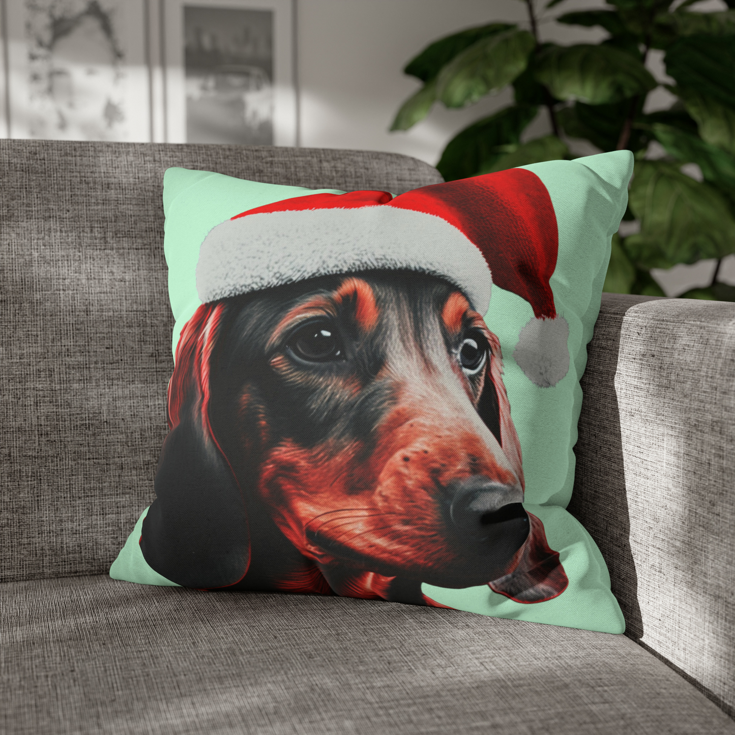 A cushion cover depicting a cute Dachshund wearing a Christmas hat, set against a calming mint green pastel background for a festive and adorable look.