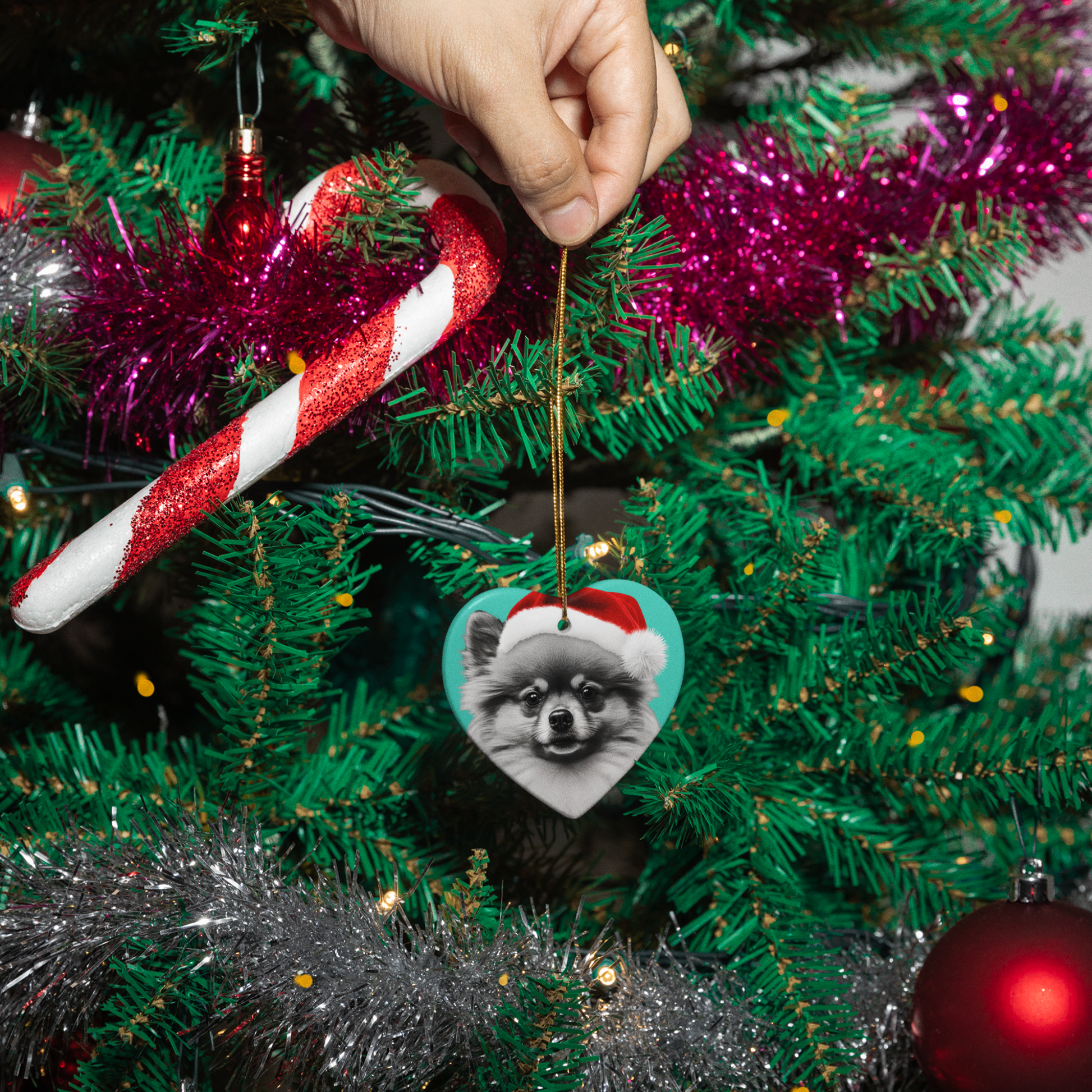 A charming Christmas tree ornament shaped like a Pomeranian, complete with festive decorations, ready to bring holiday spirit to your home